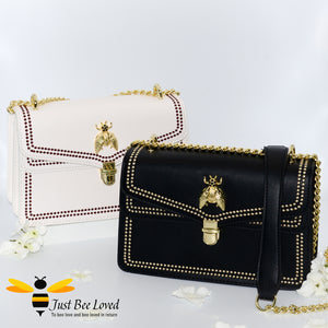 Vegan leather evening handbag with embroidery edged stitching and large gold bee embellishment