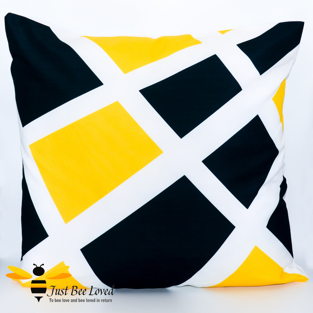 Contemporary scatter cushion featuring a black and yellow geometric design on a white background.