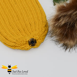 Mustard ribbed knit hat featuring a faux fur pom pom with embroidered bumblebee tab on rim