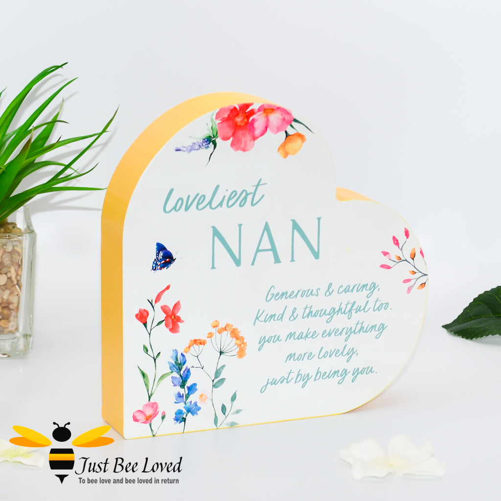 Freestanding wooden heart with "loveliest nan" text and a sentimental verse, decorated with bees and flowers.