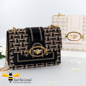Woven faux leather handbags with gold bee decoration in black and cream colours