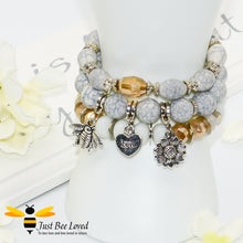 Load image into Gallery viewer, Bohemian gypsy styled 3-layer stack beaded bracelet featuring bee, love-heart and sunflower charms in white, grey and amber 