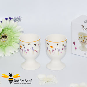 set of two matching egg cups featuring colourful watercolour design of bumblebees and lavender flowers.