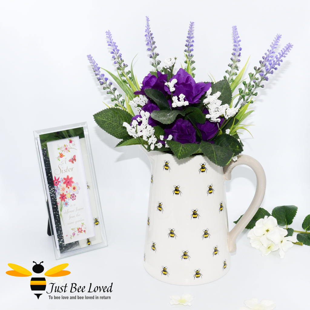 ivory ceramic flower jug featuring a decorative design of bumblebees with contrasting beige handle