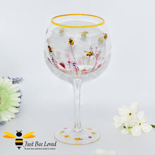 Load image into Gallery viewer,  tall stemmed balloon gin glass decorated with bumble bees in a field of flowers from the Jennifer Rose Collection