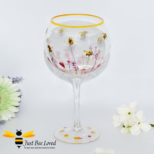  tall stemmed balloon gin glass decorated with bumble bees in a field of flowers from the Jennifer Rose Collection