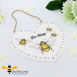 Handmade decoupaged love heart plaque painted and decorated with bumblebees and "Bee Happy" text.