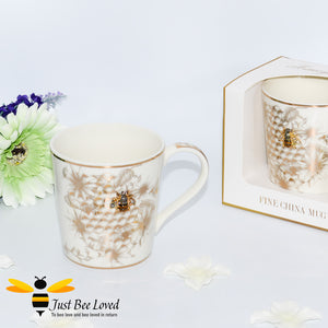 ivory fine China mug decorated with golden honeycomb, bees and flowers