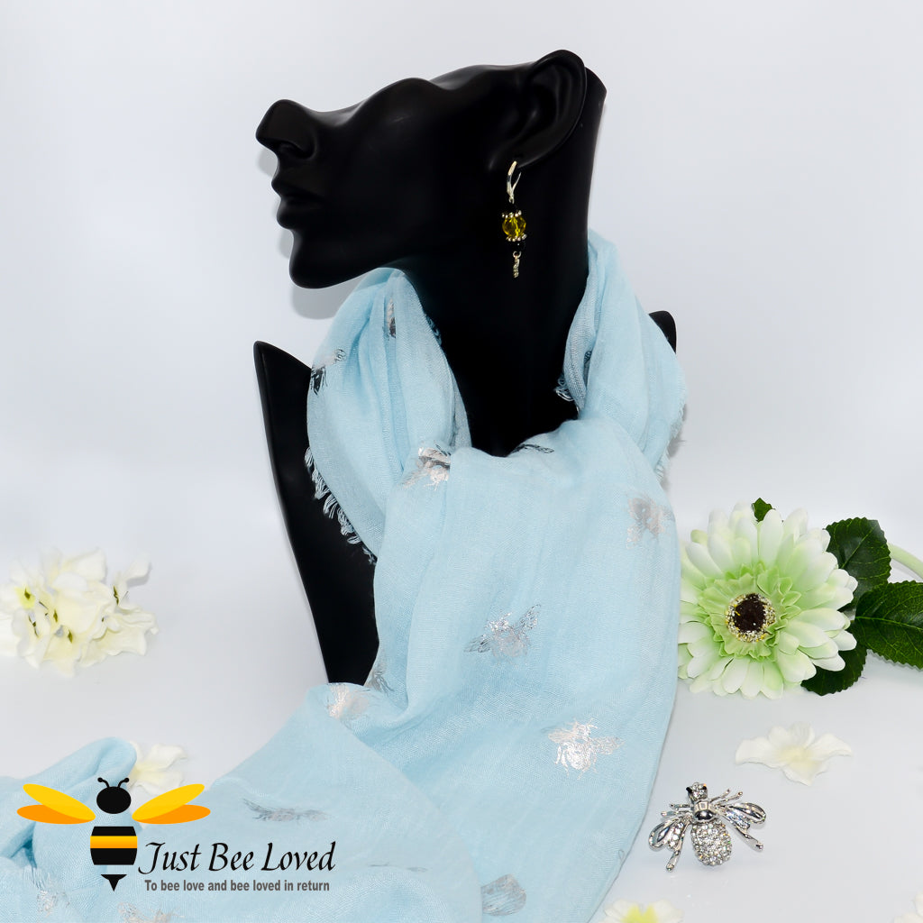 Women's light blue  lightweight scarf with silver bees print, and crystal silver bee brooch. 