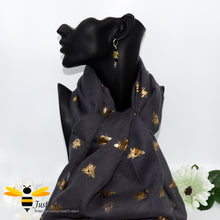 Load image into Gallery viewer, ladies scarf featuring metallic gold bumble bee print in charcoal colour, gift boxed with crystal bee brooch. 