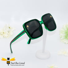 Load image into Gallery viewer, oversized retro styled square sunglasses featuring sweet gold bees on each lens in dark green colour