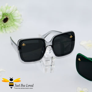 oversized retro styled square sunglasses featuring sweet gold bees on each lens in grey framed colour.