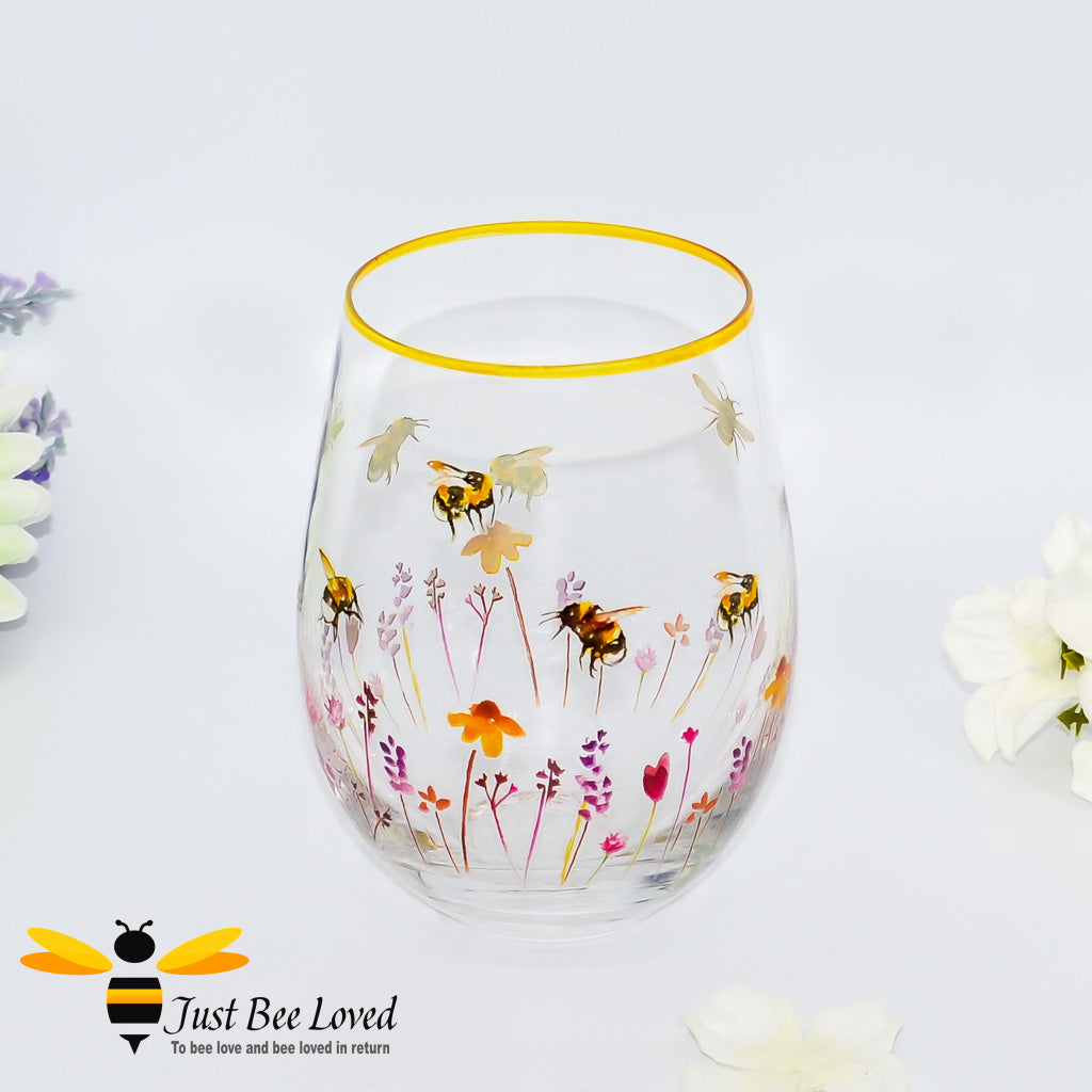 Jennifer Rose busy bees stemless wine glass with gold rim.