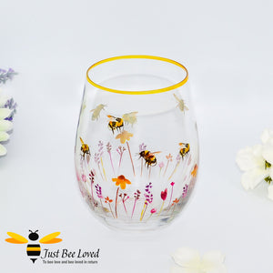 stemless wine glass decorated with watercolour design of bumblebees and lavender flowers with gold rim