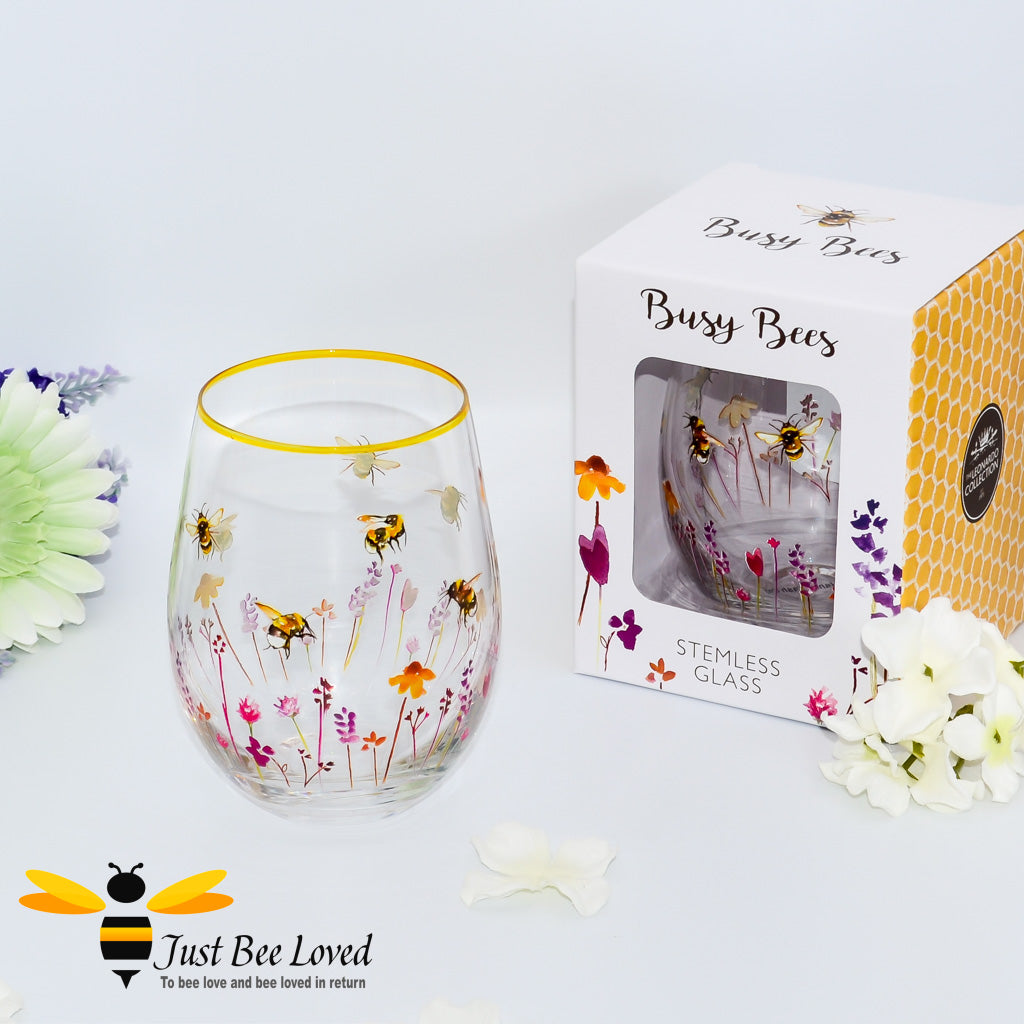 stemless wine glass decorated with watercolour design of bumblebees and lavender flowers with gold rim