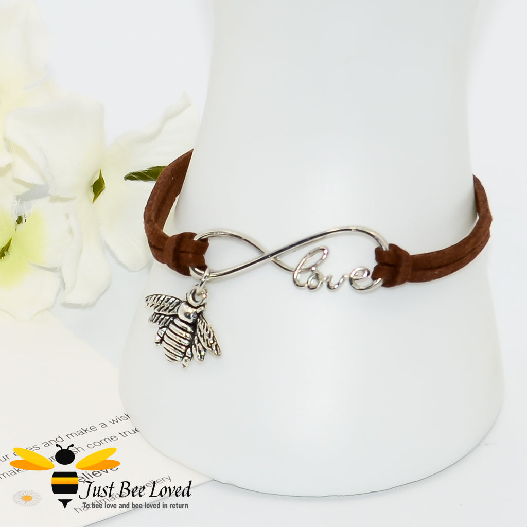 Brown faux leather bracelet featuring a Tibetan silver bee charm with love link
