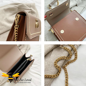 two-tone brown PU with large vintage gold bee embellishment, contrasting cream stitching, gold side studs with matching strap of part leather and gold chain.