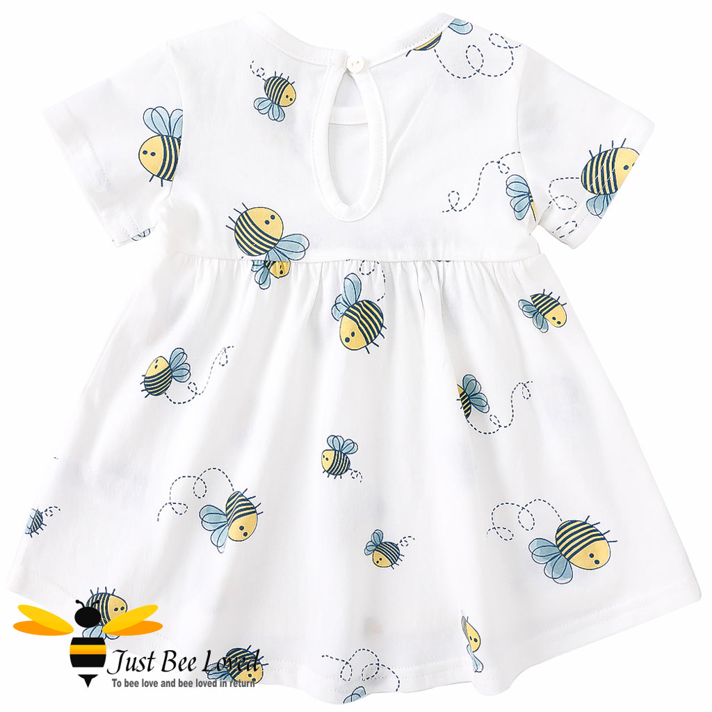 short sleeved white swing dress featuring an all over pretty little bees print decorated with a coordinating navy bow.