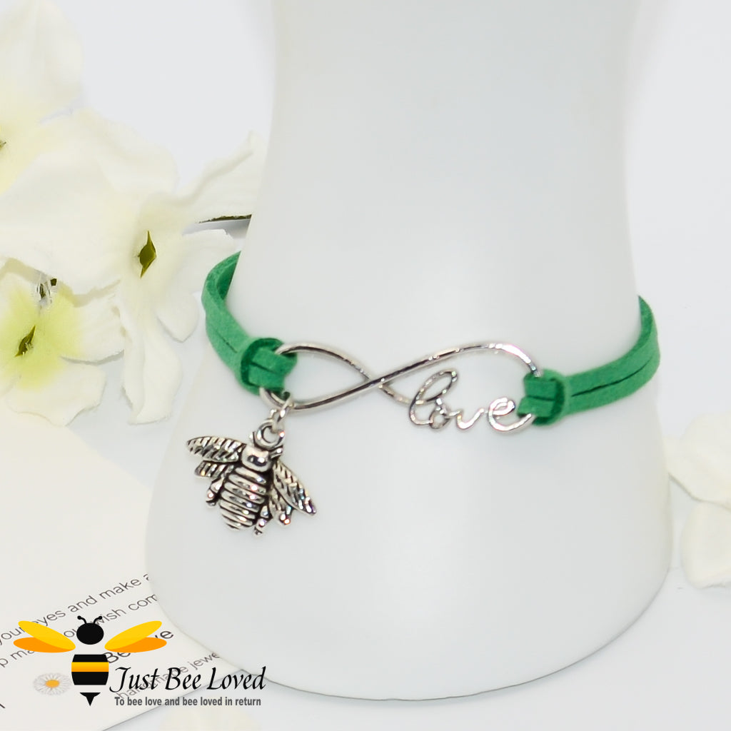 green faux leather bracelet featuring a bee charm with love link