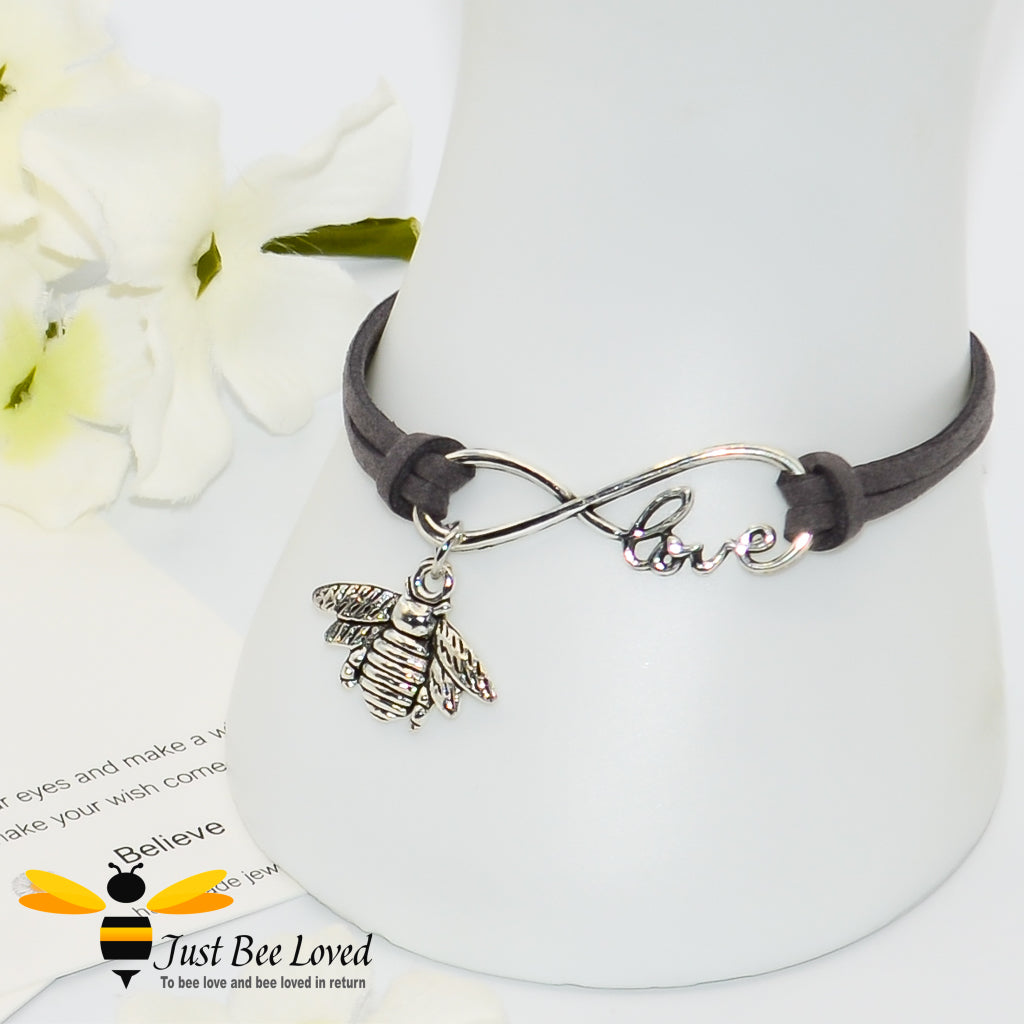 faux grey suede leather bracelet featuring a bee charm with love link