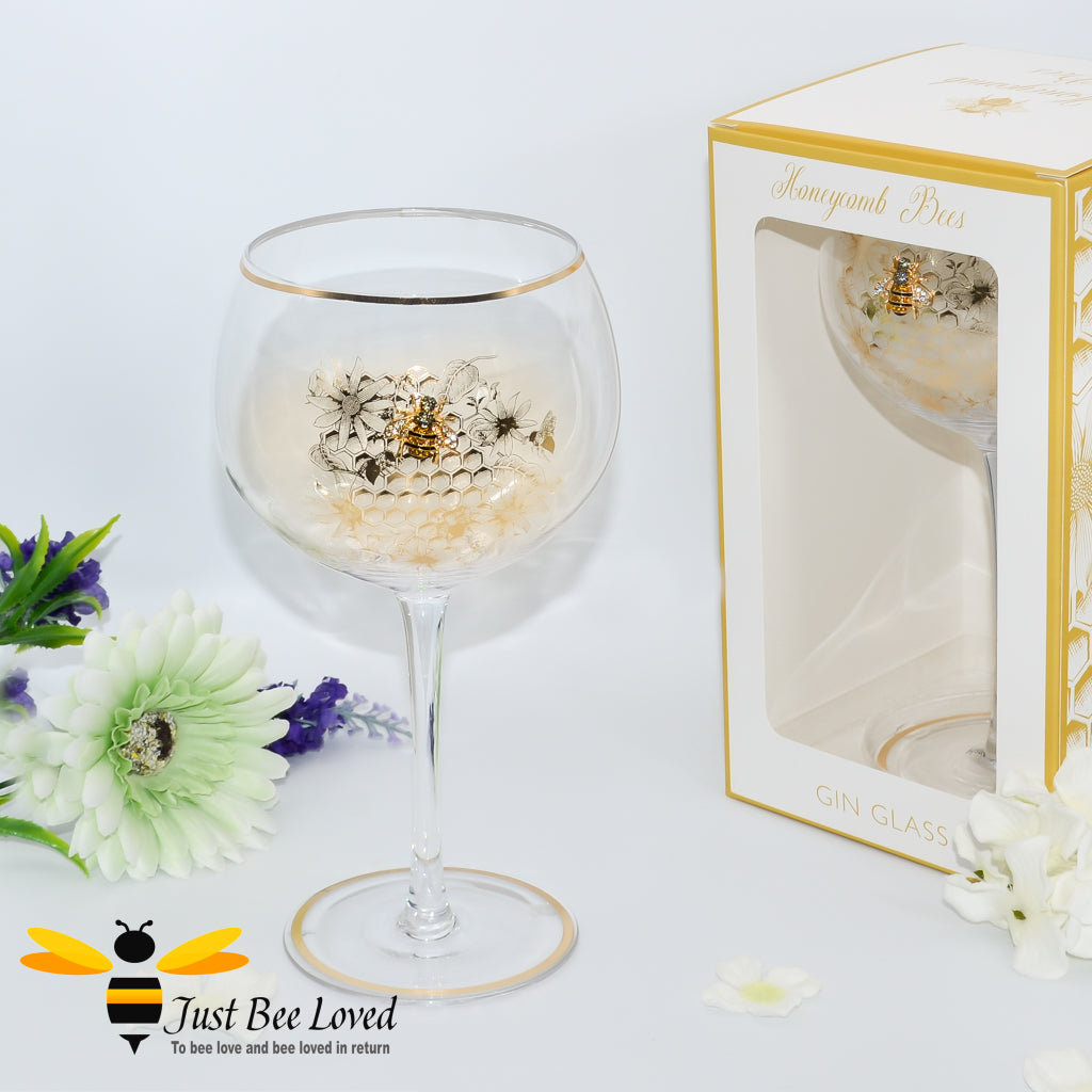tall stemmed balloon gin glass decorated with golden honeycomb with 3D crystal bee and gold rim