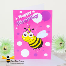Load image into Gallery viewer, image of a pink bee themed birthday card featuring a cartoon illustrations of a young bee wearing a party hat with white and purple balloons.