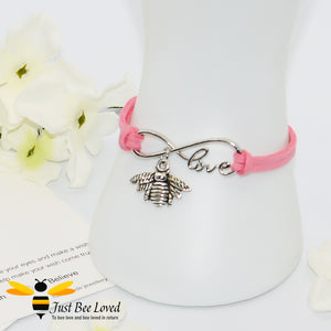 Handmade faux pink suede leather bracelet featuring a bee charm with love link