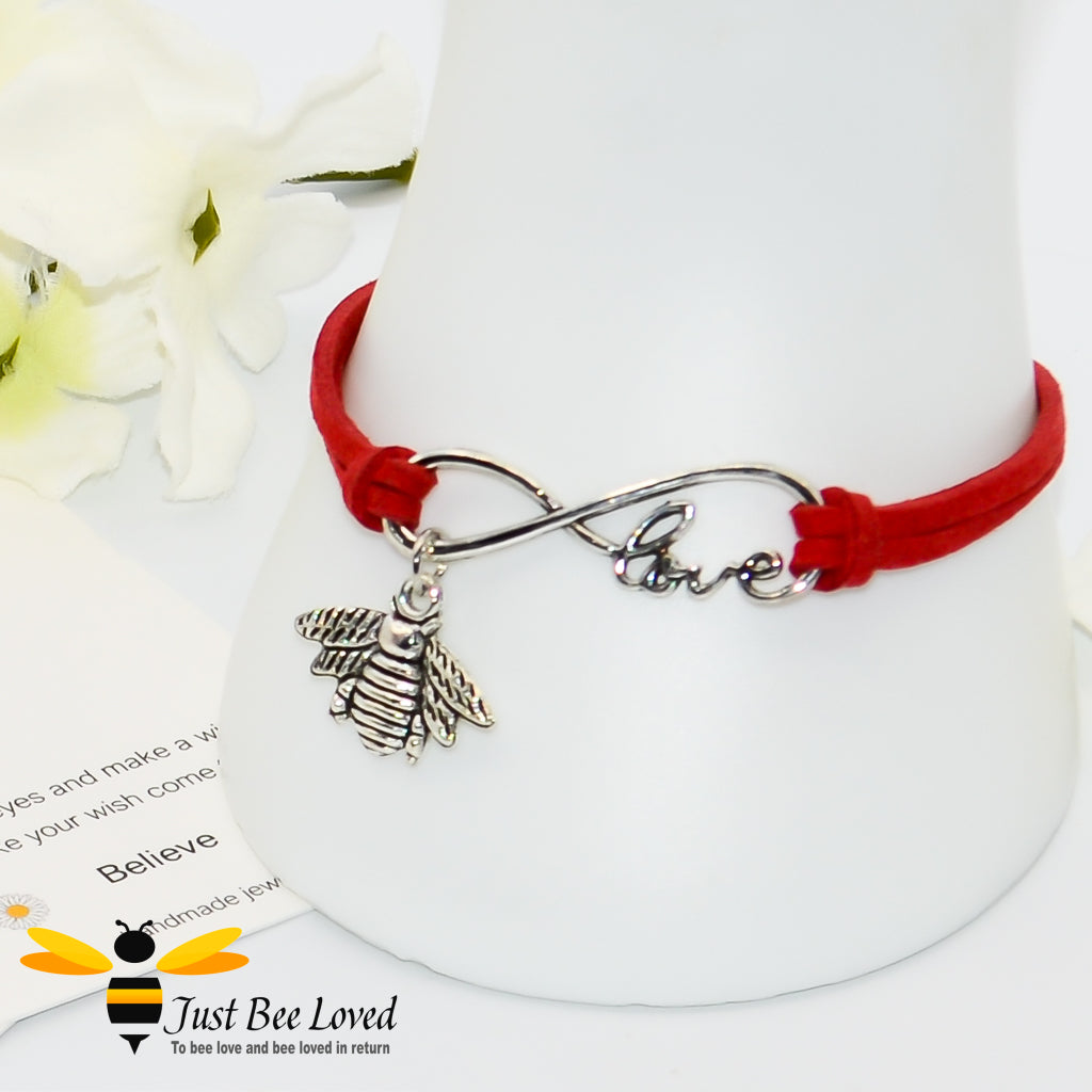 Red faux leather bracelet featuring a bee charm with love link