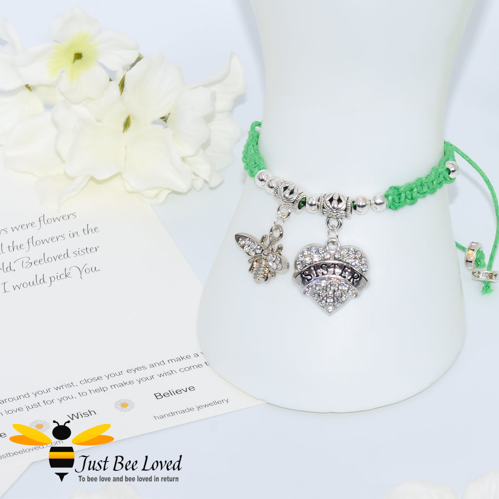 green Shamballa wish bracelet featuring a crystal bee and heart charm engraved with "Sister" and a sister verse card.