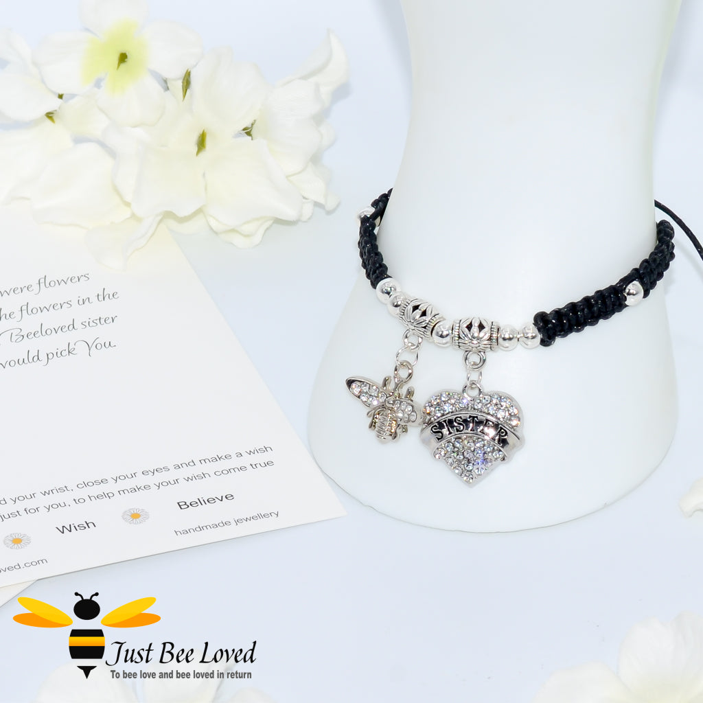 Black Shamballa wish bracelet featuring a crystal bee and heart charm engraved with "Sister" and a sister verse card.