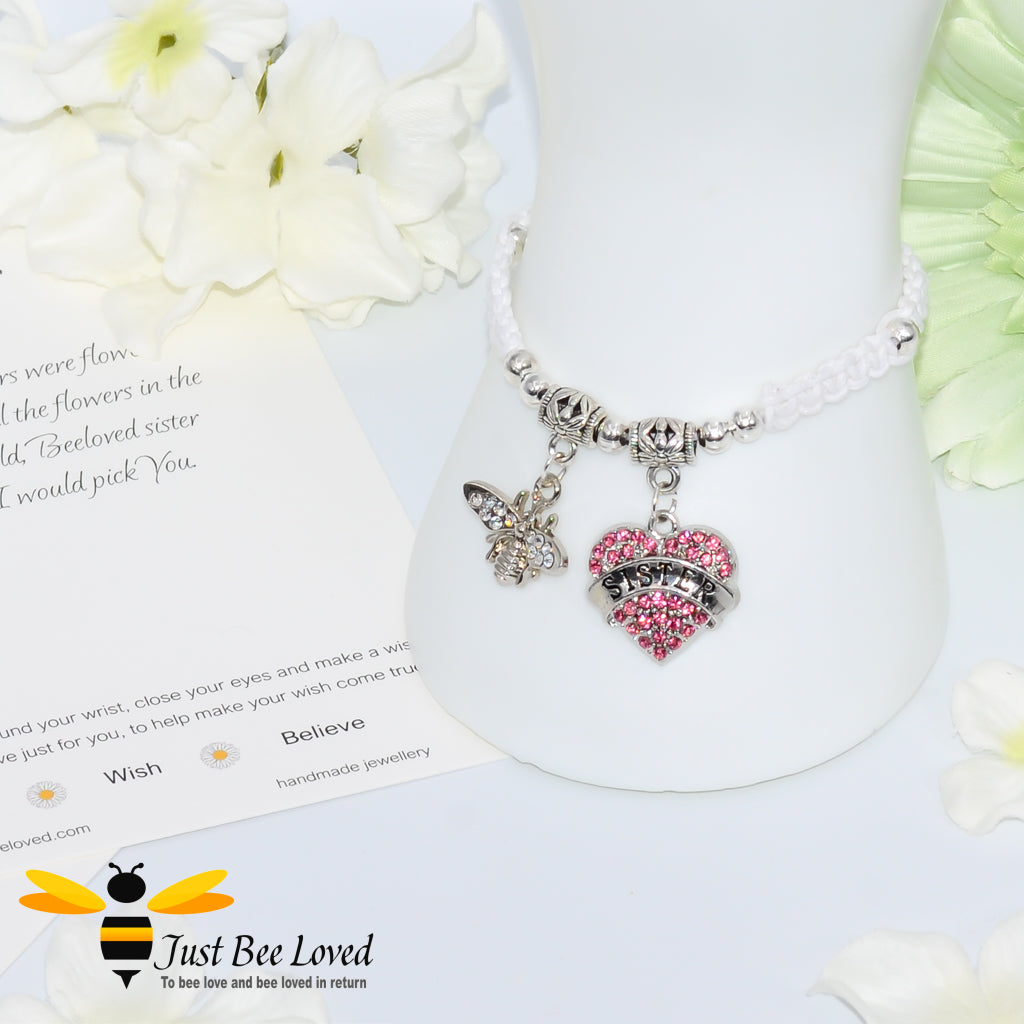 White Shamballa wish bracelet featuring a crystal bee and heart charm engraved with "Sister" and a sister verse card.