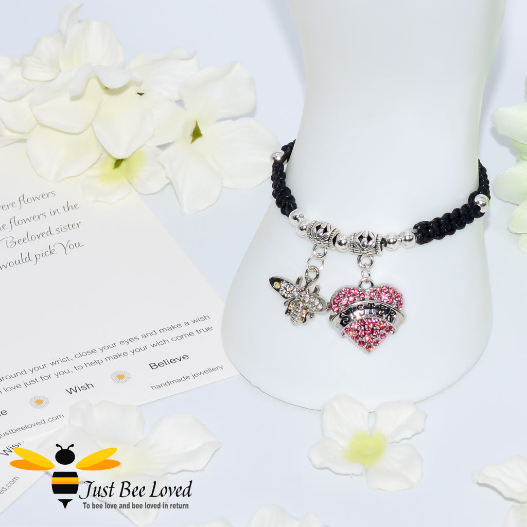 Black Shamballa wish bracelet featuring a crystal bee and heart charm engraved with "Sister" and a sister verse card.
