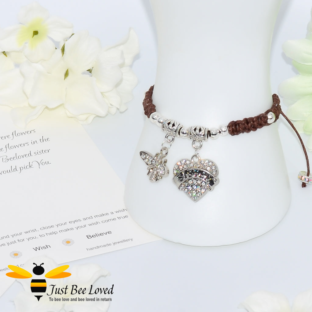 Brown Shamballa wish bracelet featuring a crystal bee and heart charm engraved with "Sister" and a sister verse card.
