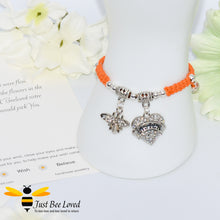Load image into Gallery viewer, handmade orange Shamballa wish charm bracelet featuring a bee and love heart engraved with &quot;Sister&quot; with sentimental verse display card