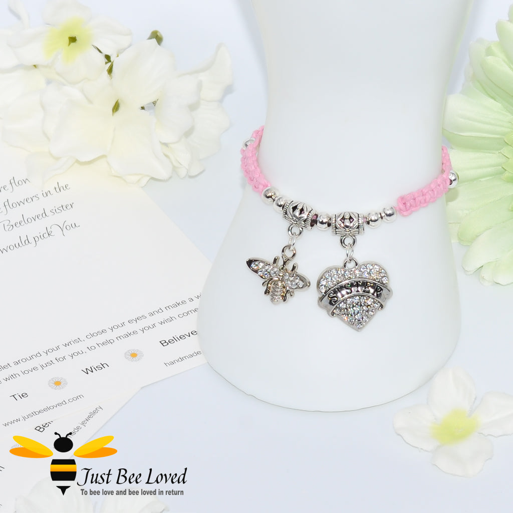 Pink Shamballa wish bracelet featuring a crystal bee and heart charm engraved with "Sister" and a sister verse card.