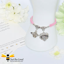 Load image into Gallery viewer, handmade pink Shamballa wish charm bracelet featuring a bee and love heart engraved with &quot;Sister&quot; with sentimental verse display card