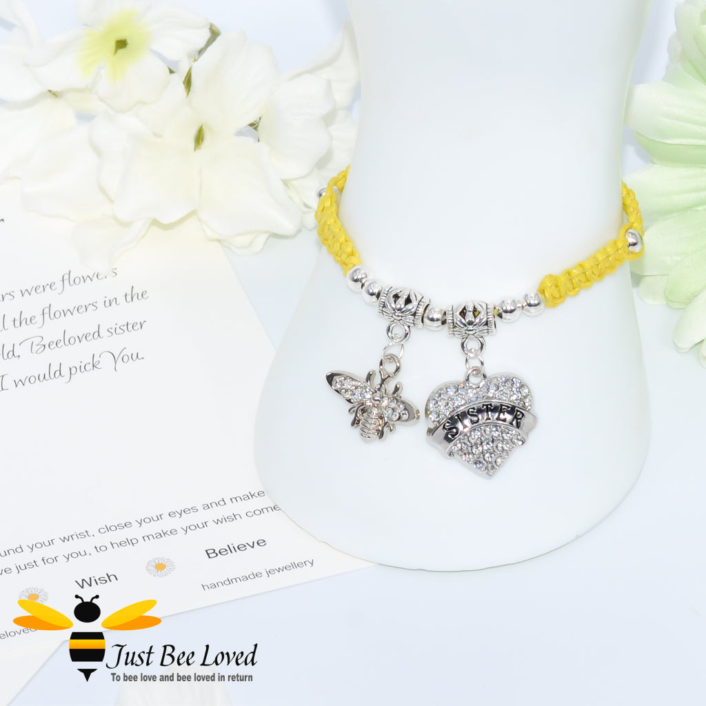 Yellow Shamballa wish bracelet featuring a crystal bee and heart charm engraved with "Sister" and a sister verse card.