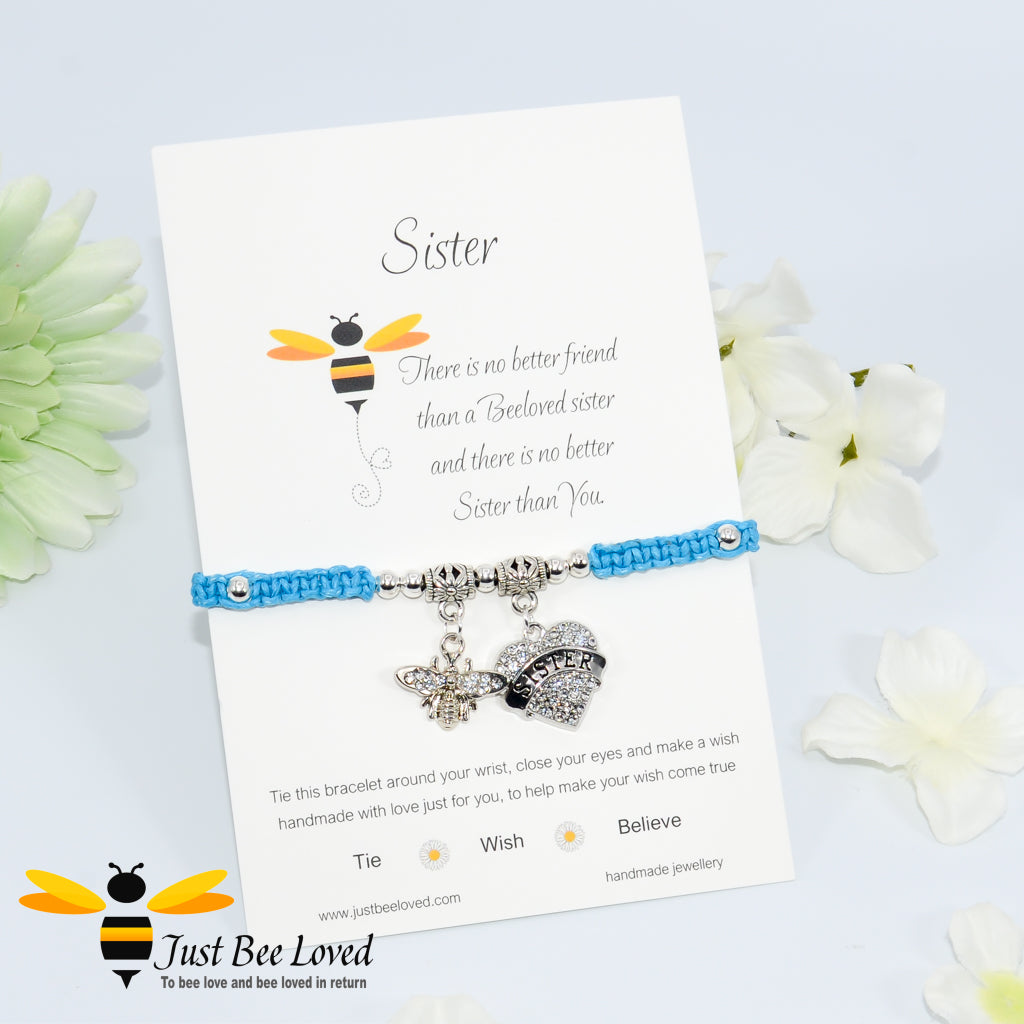 Blue Shamballa wish bracelet featuring a crystal bee and heart charm engraved with "Sister" and a sister verse card.