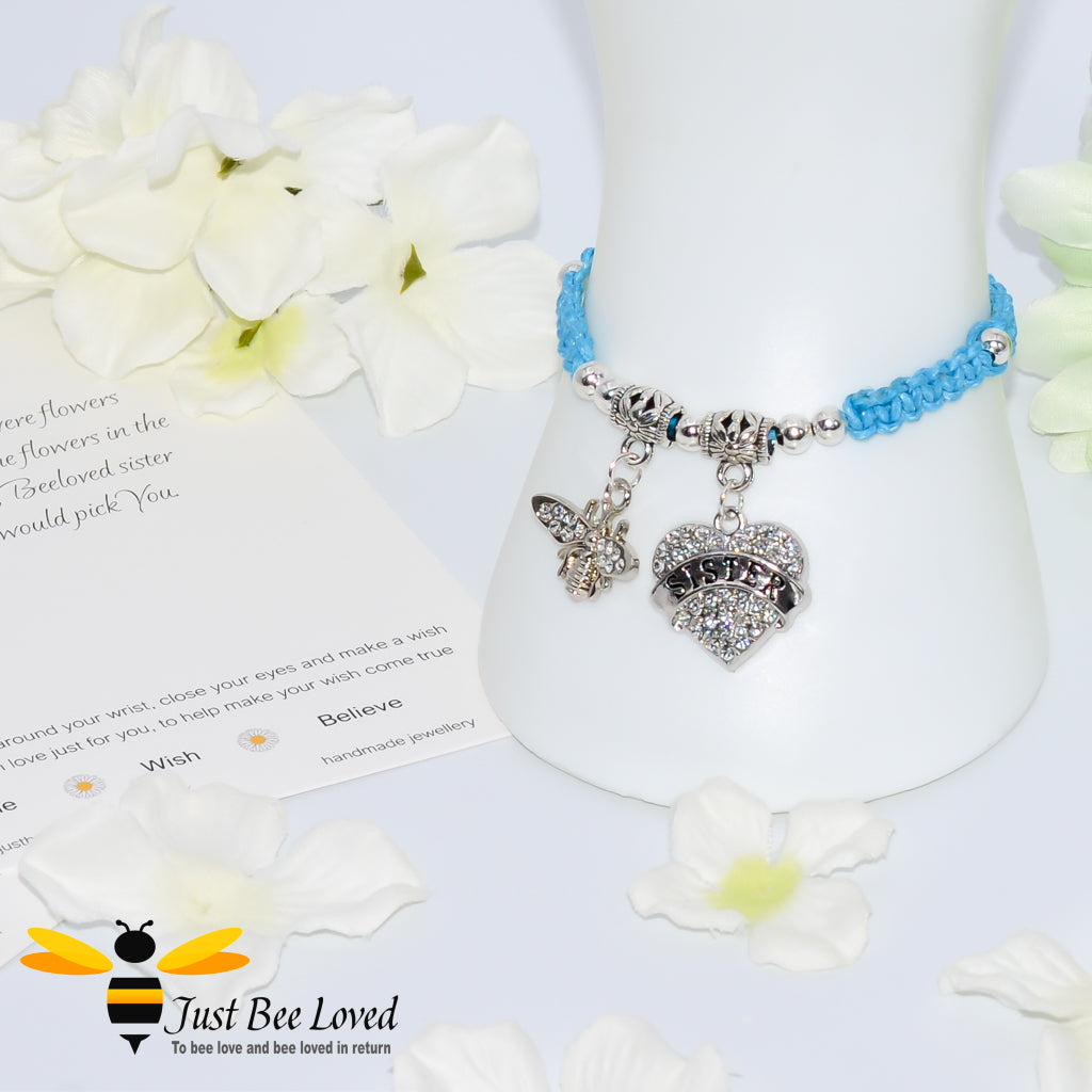 Blue Shamballa wish bracelet featuring a crystal bee and heart charm engraved with "Sister" and a sister verse card.