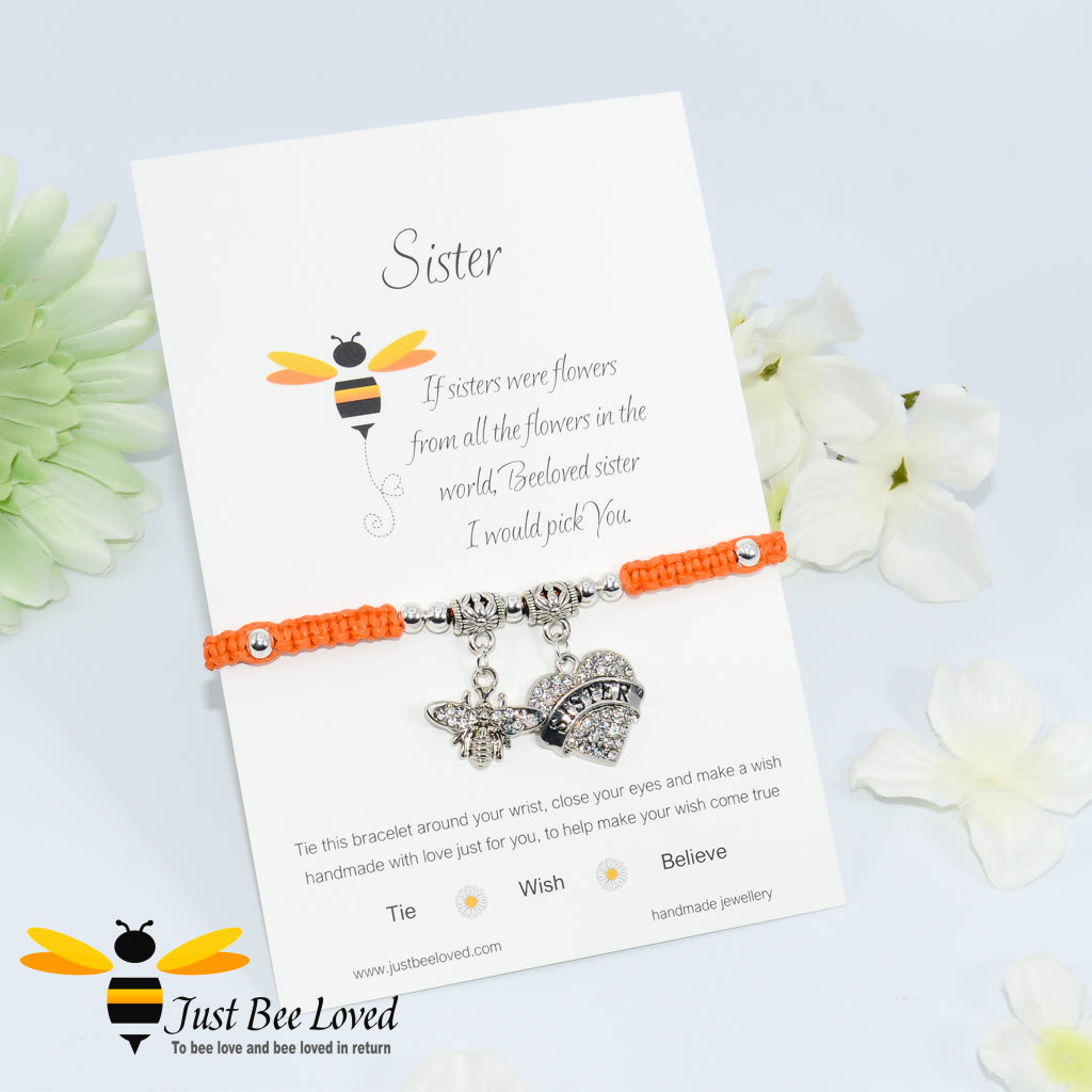 Orange Shamballa wish bracelet featuring a crystal bee and heart charm engraved with "Sister" and a sister verse card.