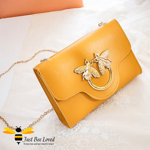 Just Bee Loved Elegant mini soft pu leather handbag with gold chain strap featuring large twin bees link embellishment in five colours, black, mustard, light green, orange and salmon pink