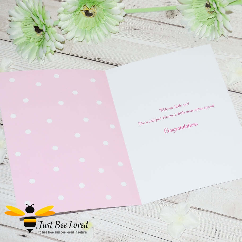 image of a pink bee themed new baby girl bee greeting card with honeycomb pattern.